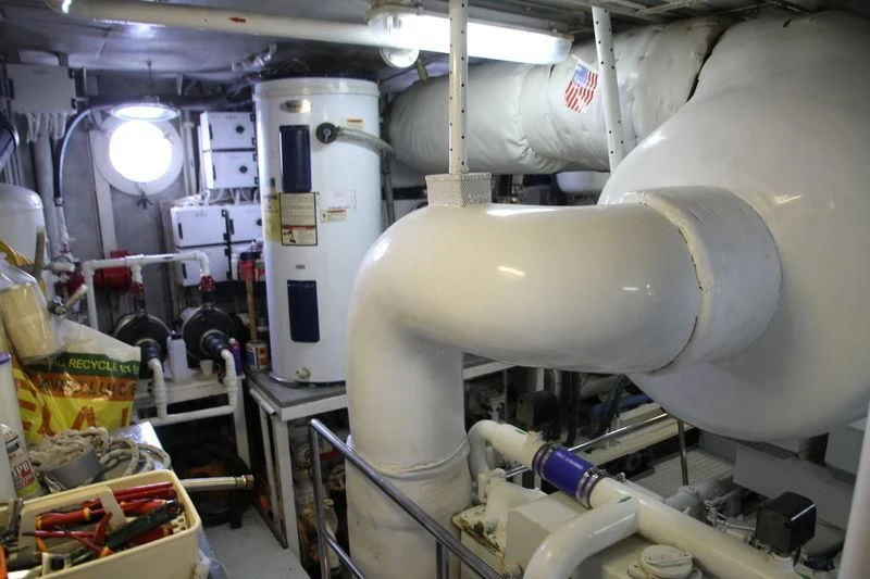 a large white machine in a room aboard SEAGULL OF CAYMAN Yacht for Sale