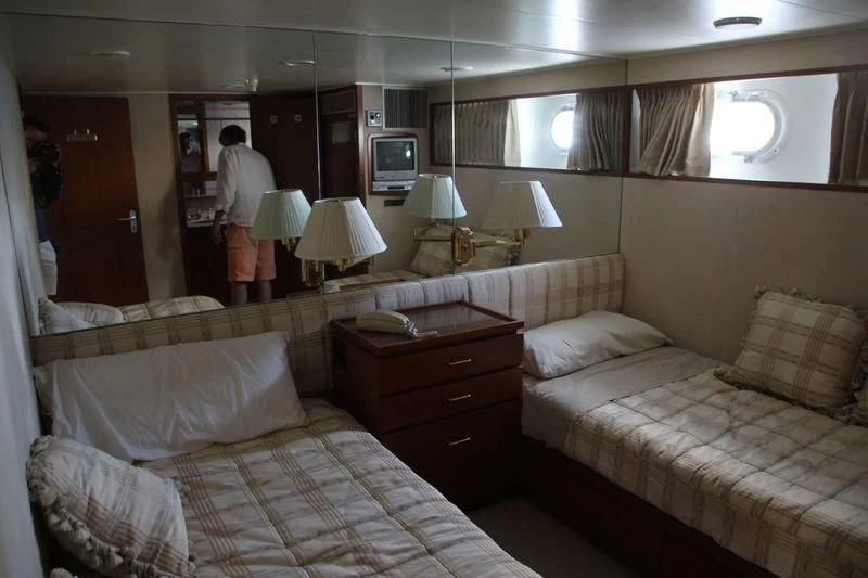 a hotel room with two beds aboard SEAGULL OF CAYMAN Yacht for Sale