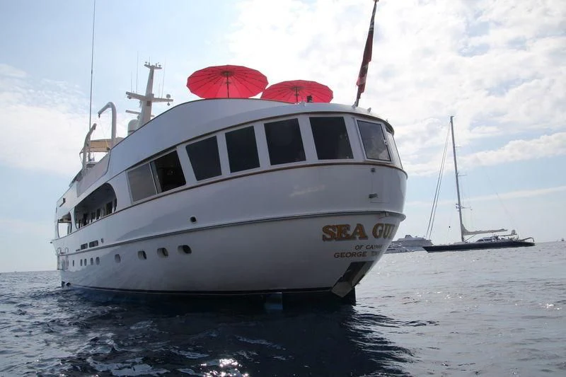 a white boat in the water aboard SEAGULL OF CAYMAN Yacht for Sale