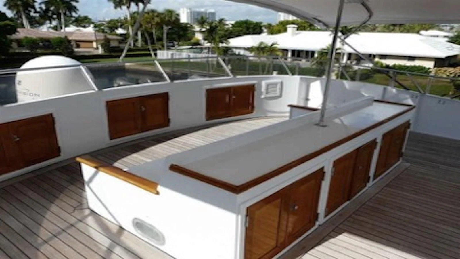 a deck with a deck and a pool aboard SEAGULL OF CAYMAN Yacht for Sale
