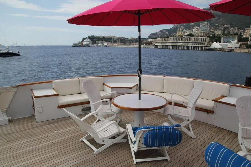 a table and chairs on a boat aboard SEAGULL OF CAYMAN Yacht for Sale