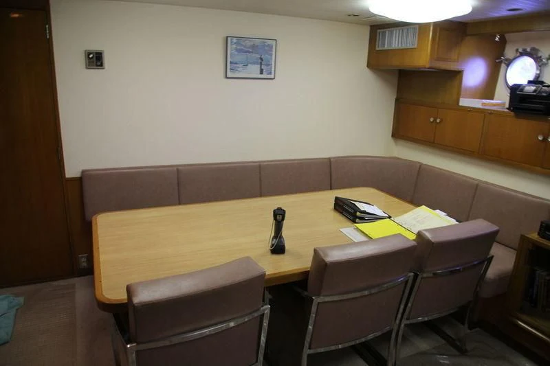 a room with a couch and chairs aboard SEAGULL OF CAYMAN Yacht for Sale