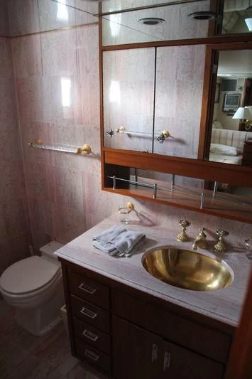 a bathroom with a sink and a toilet aboard SEAGULL OF CAYMAN Yacht for Sale