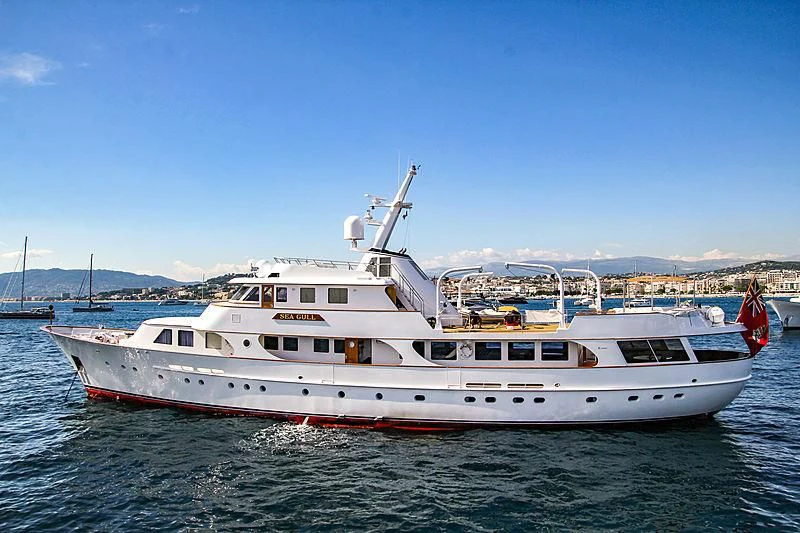 a white yacht in the water aboard SEAGULL OF CAYMAN Yacht for Sale