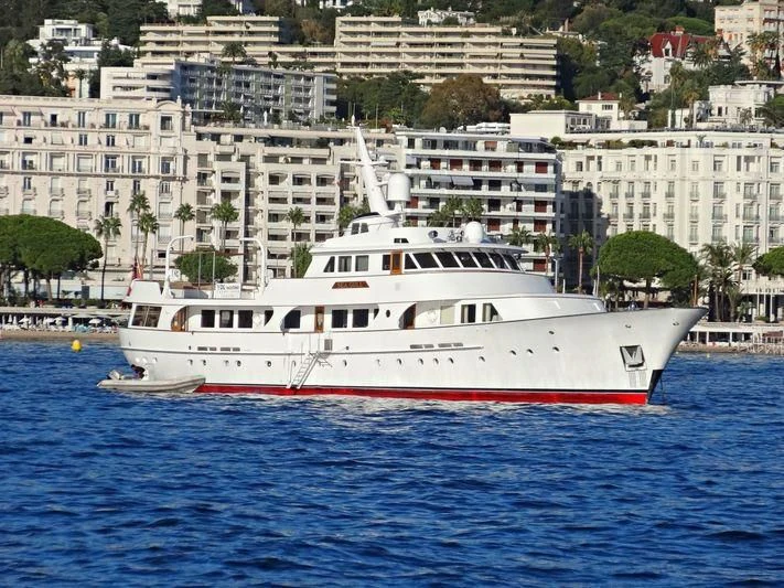 a white boat in the water aboard SEAGULL OF CAYMAN Yacht for Sale