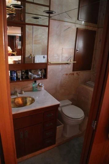 a bathroom with a sink and toilet aboard SEAGULL OF CAYMAN Yacht for Sale