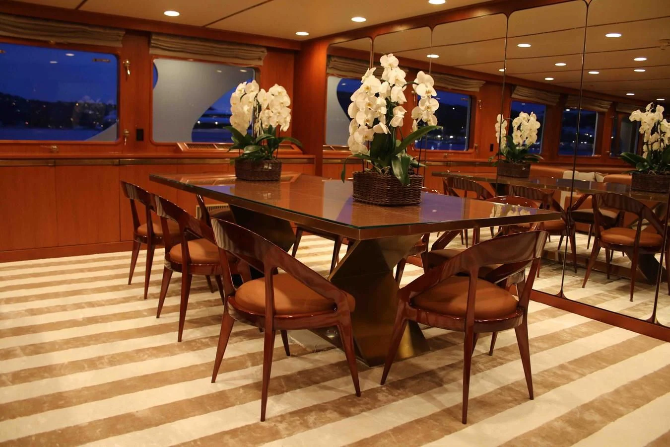 a table with chairs around it aboard SEAGULL OF CAYMAN Yacht for Sale