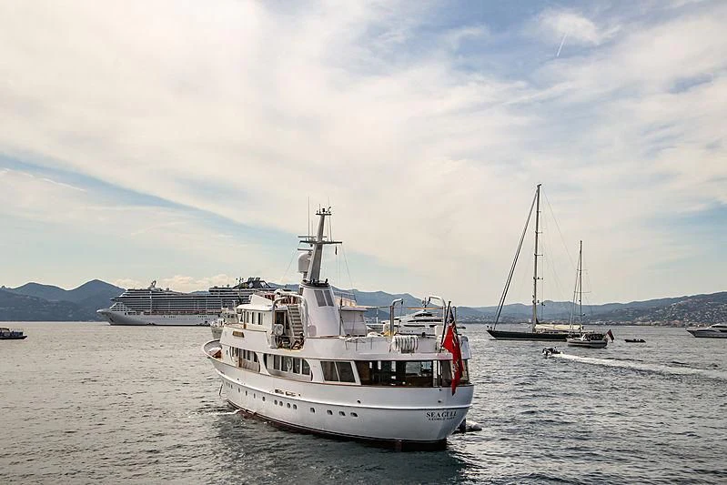 a boat is sailing in the water aboard SEAGULL OF CAYMAN Yacht for Sale