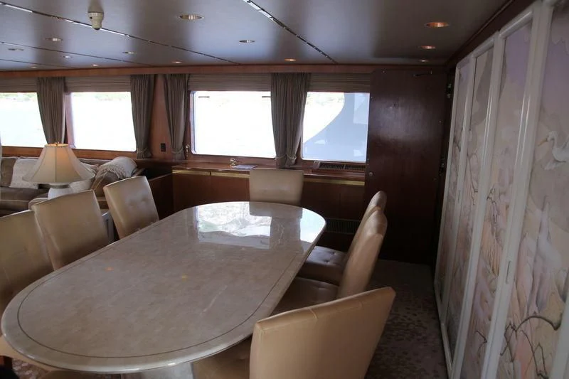 a room with a table and chairs aboard SEAGULL OF CAYMAN Yacht for Sale