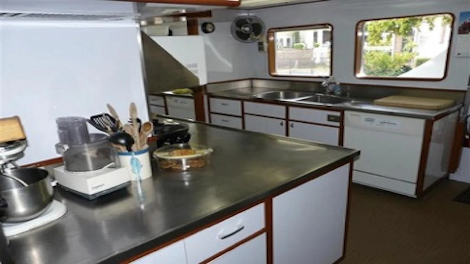 a kitchen with a large window aboard SEAGULL OF CAYMAN Yacht for Sale