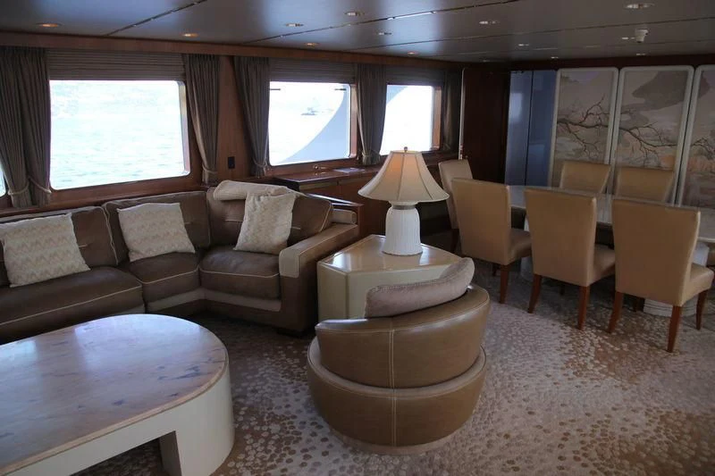 a living room with a couch and a table aboard SEAGULL OF CAYMAN Yacht for Sale