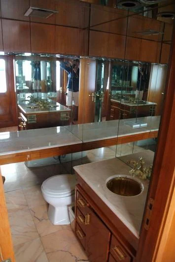 a bathroom with a large mirror aboard SEAGULL OF CAYMAN Yacht for Sale