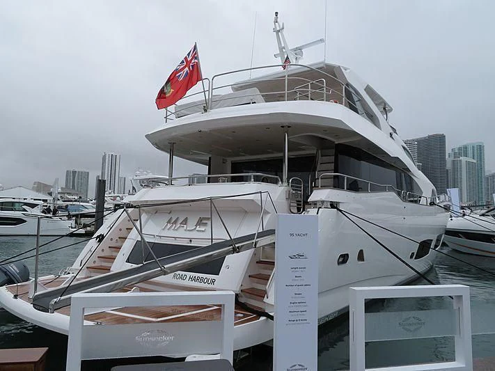 a boat with a flag on the front aboard REUNION Yacht for Sale