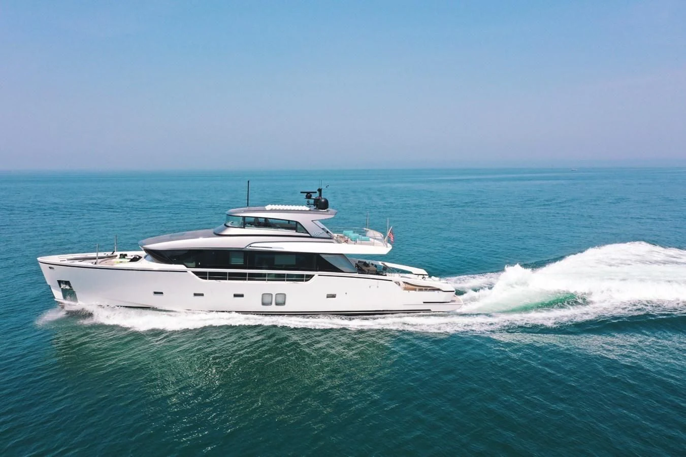 a white yacht in the ocean aboard MAVE Yacht for Sale