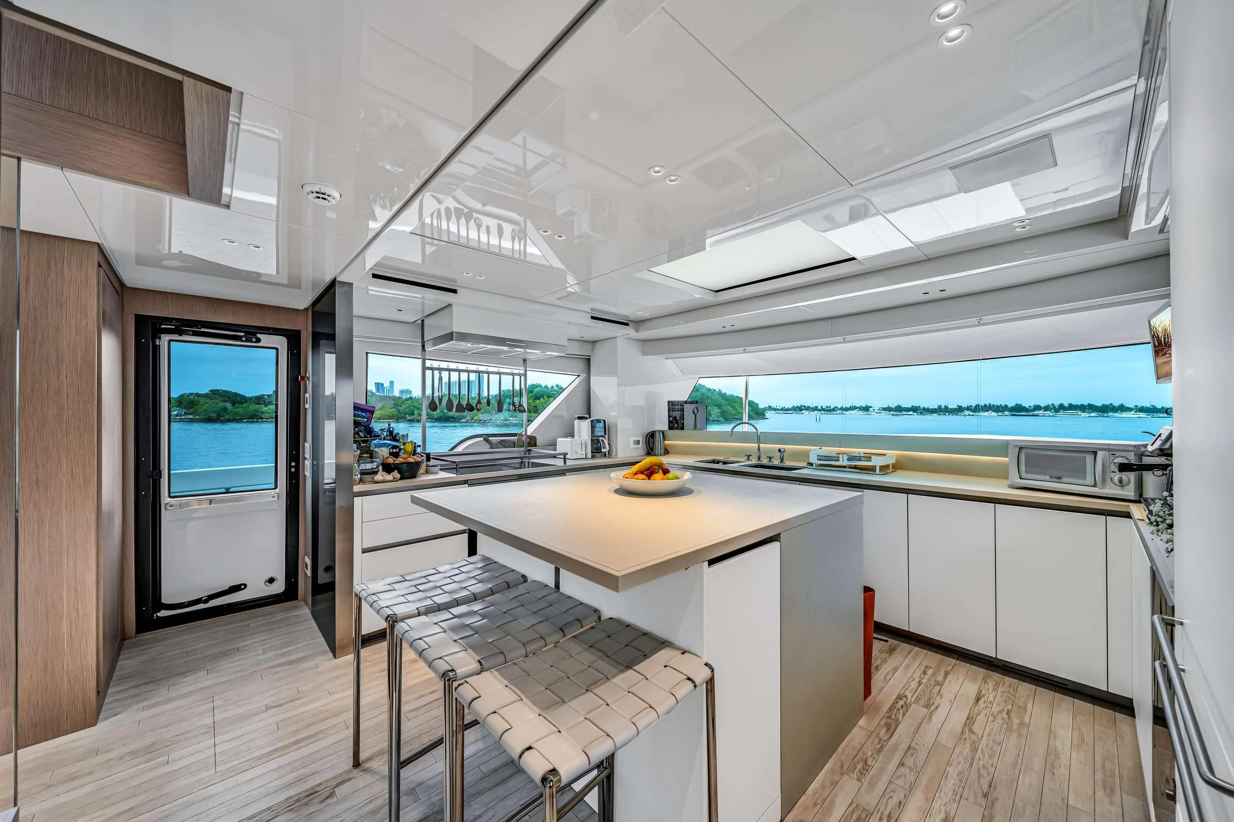 a room with a table and chairs aboard MAVE Yacht for Sale