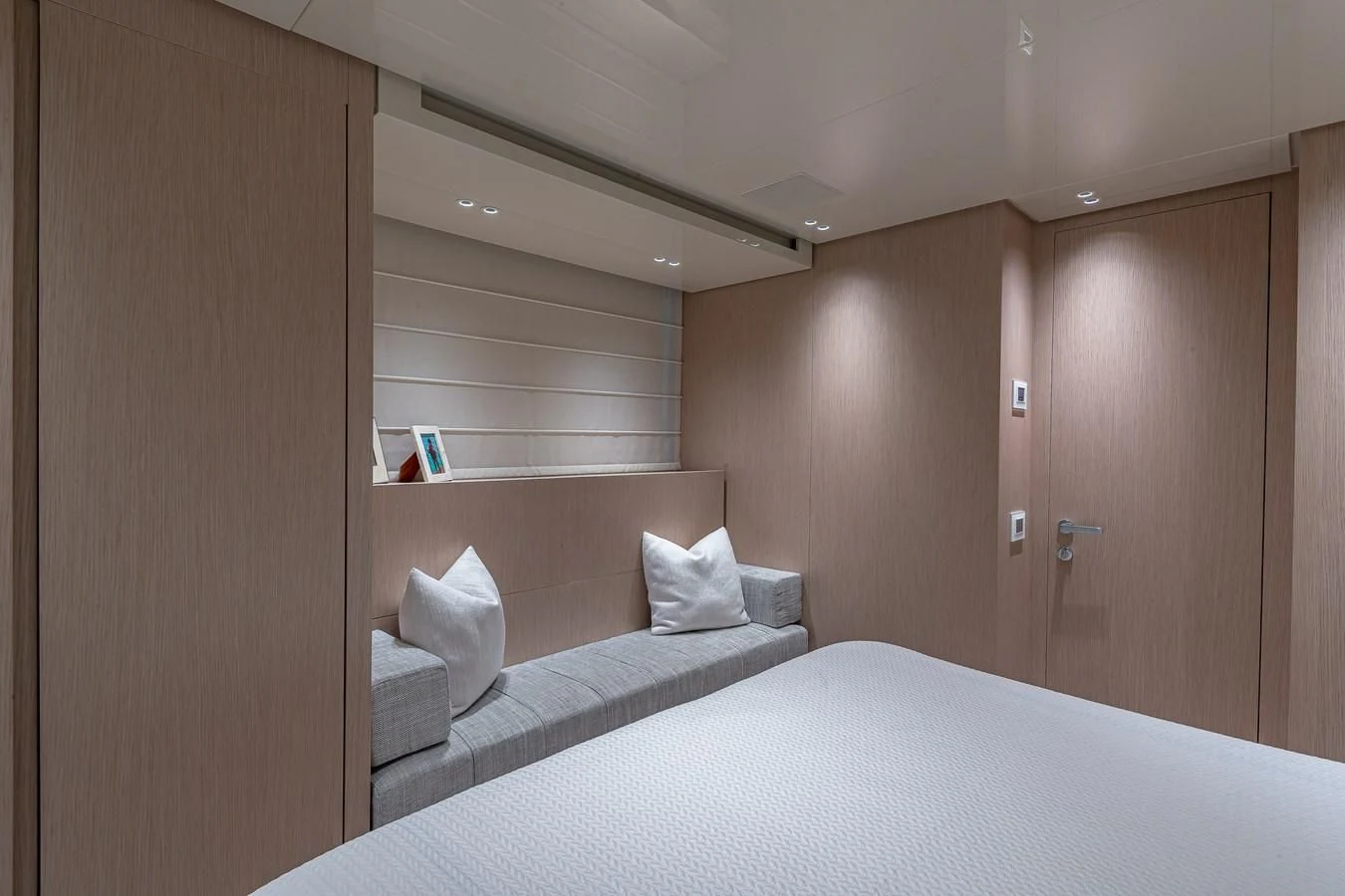 a room with a bed and a closet aboard MAVE Yacht for Sale