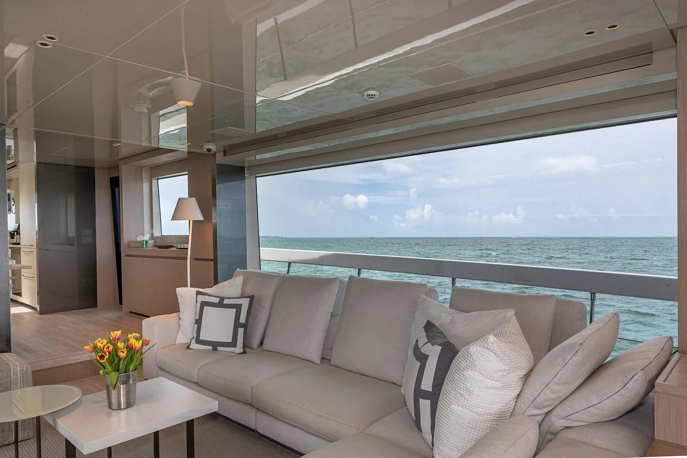 a living room with a large window aboard MAVE Yacht for Sale