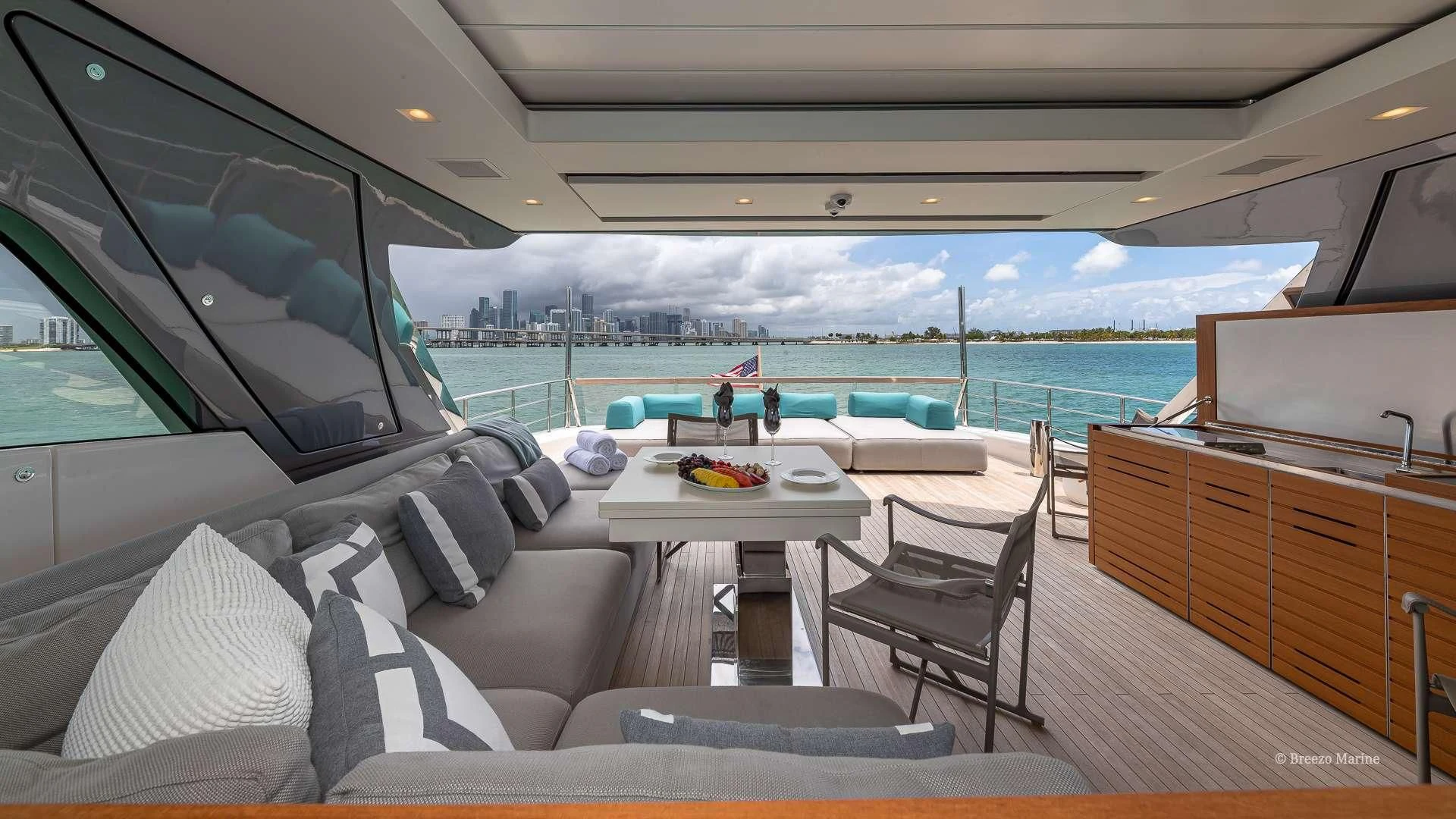 a boat with a table and chairs aboard MAVE Yacht for Sale