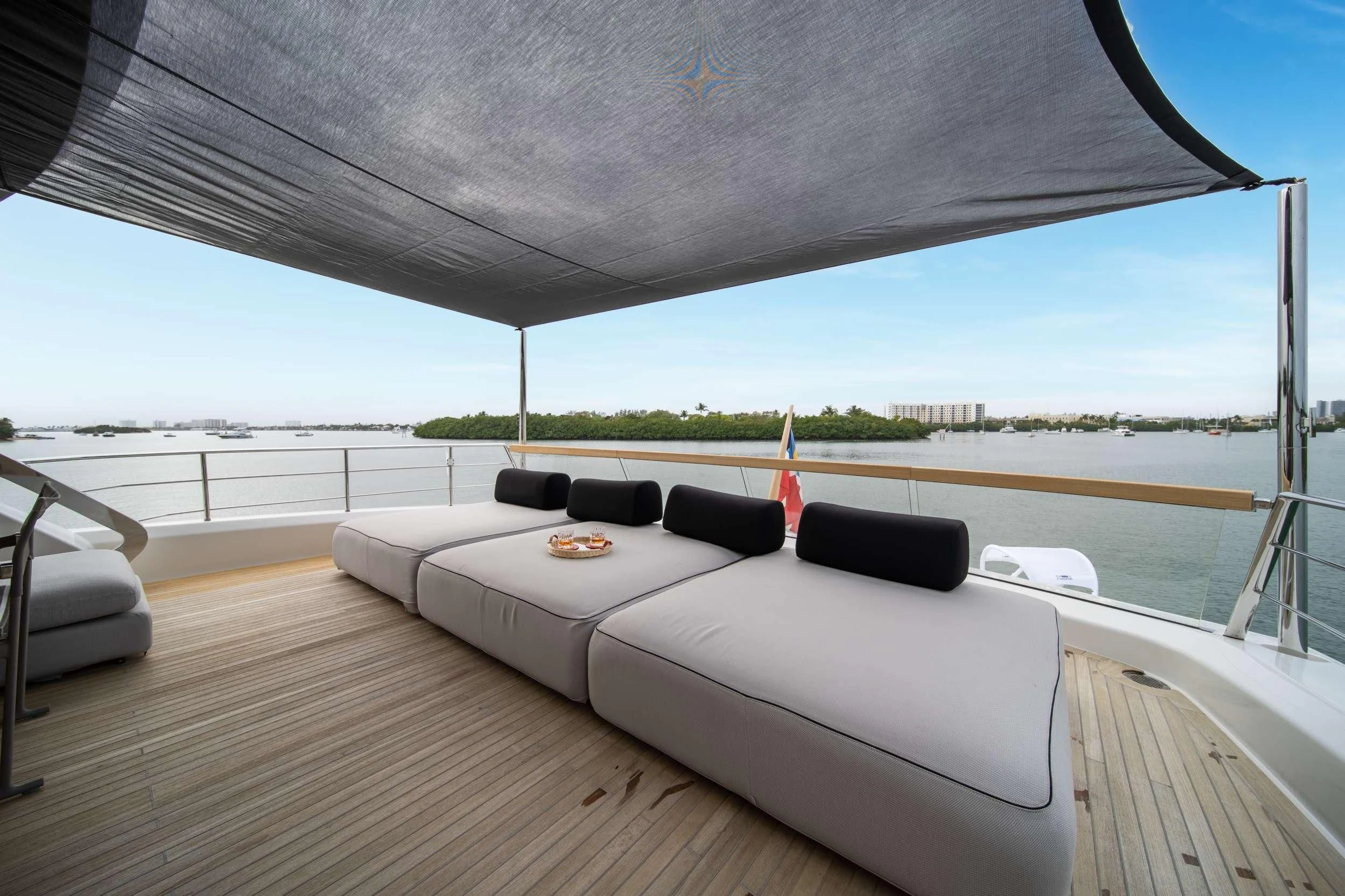 a large bed on a deck aboard MAVE Yacht for Sale
