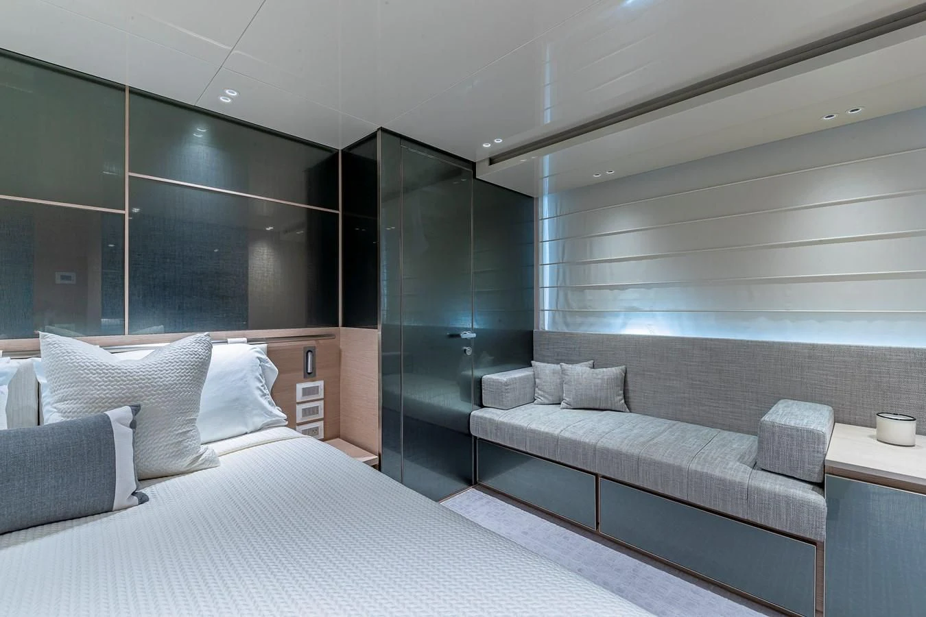 a room with a bed and a couch aboard MAVE Yacht for Sale