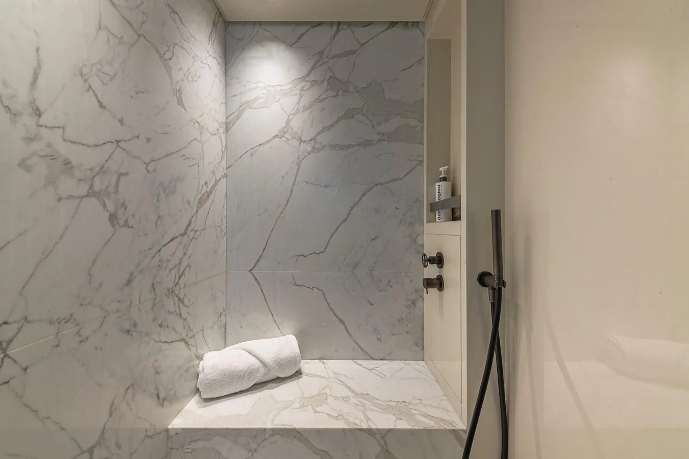 a bathroom with a towel on the floor aboard MAVE Yacht for Sale