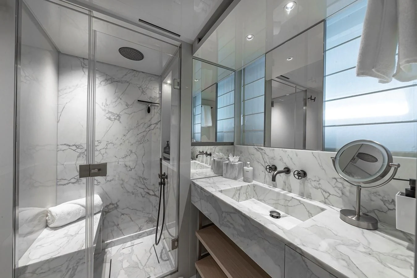 a bathroom with a large mirror aboard MAVE Yacht for Sale