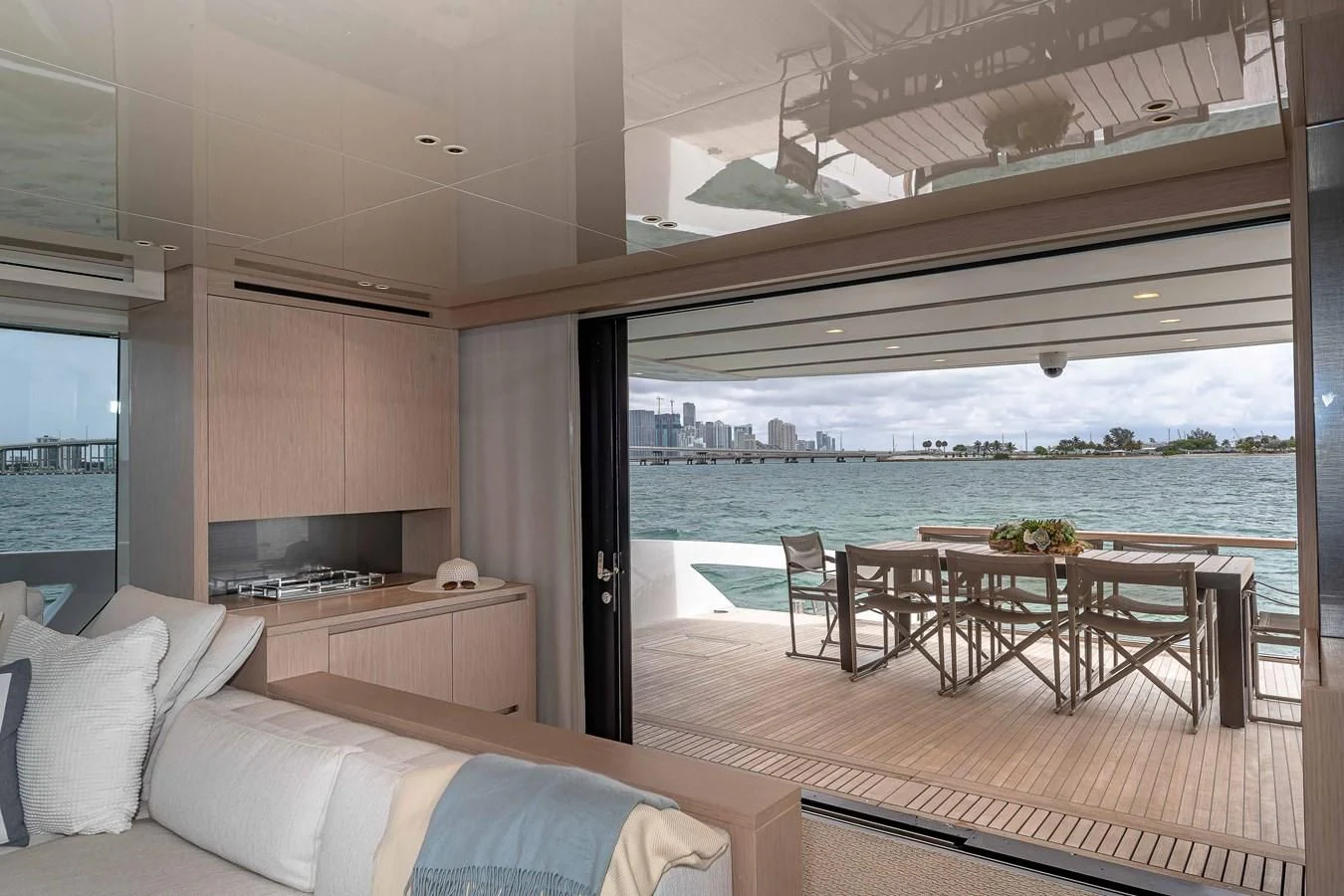 a room with a table and chairs aboard MAVE Yacht for Sale