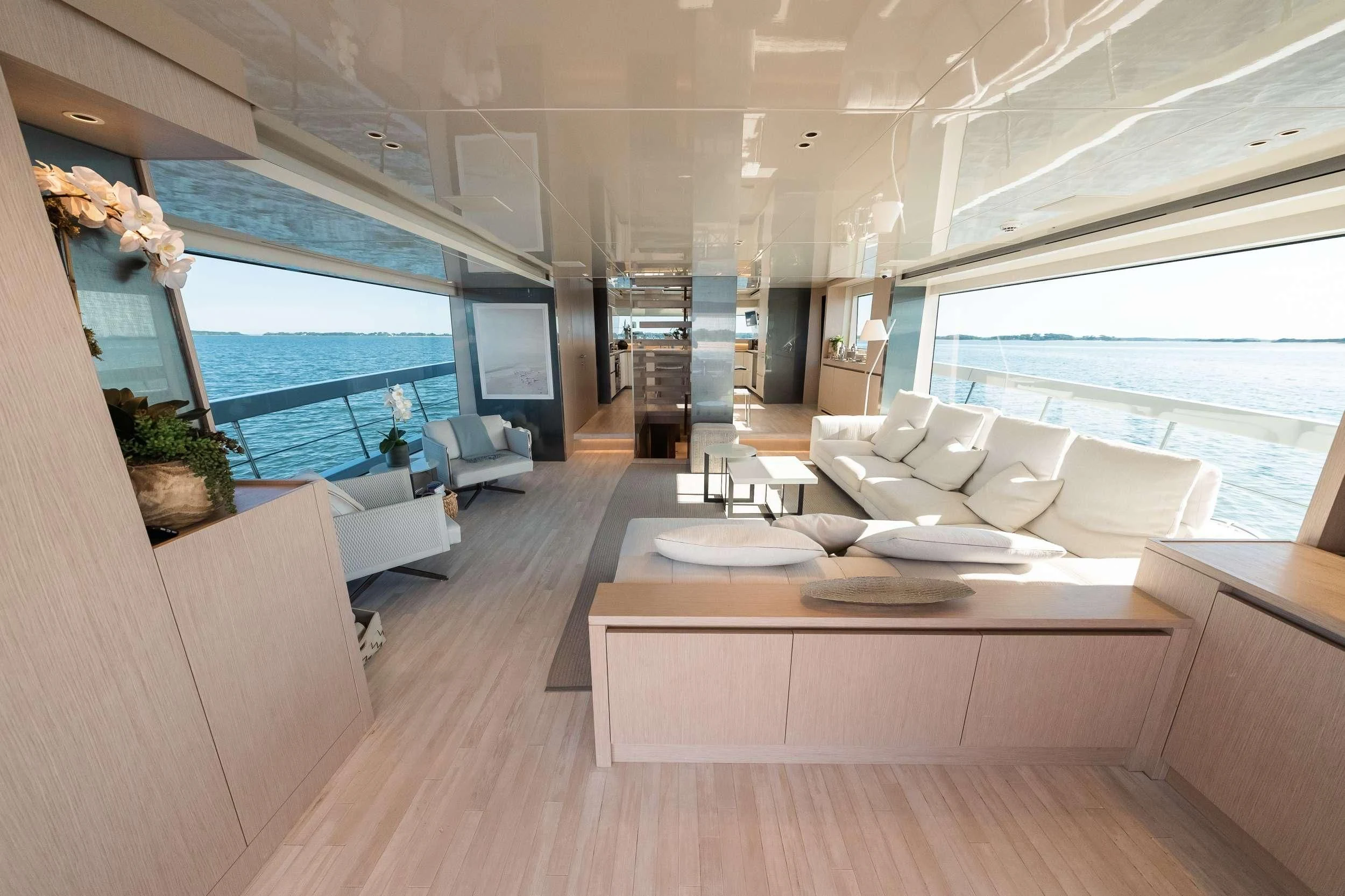 a room with a large window and a view of the ocean aboard MAVE Yacht for Sale