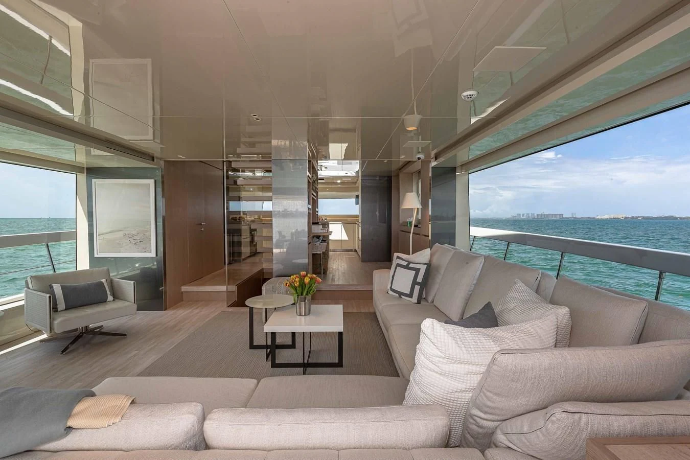 a living room with a large window aboard MAVE Yacht for Sale