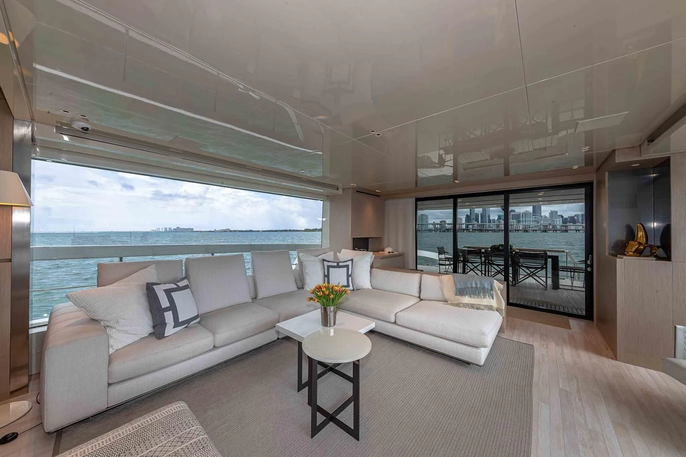 a living room with a large window aboard MAVE Yacht for Sale