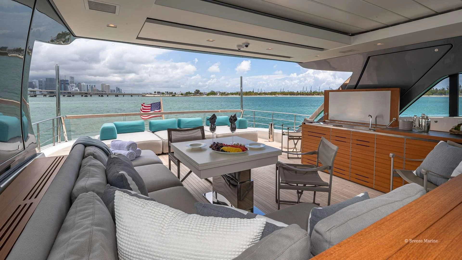 a room with a table chairs and a television aboard MAVE Yacht for Sale