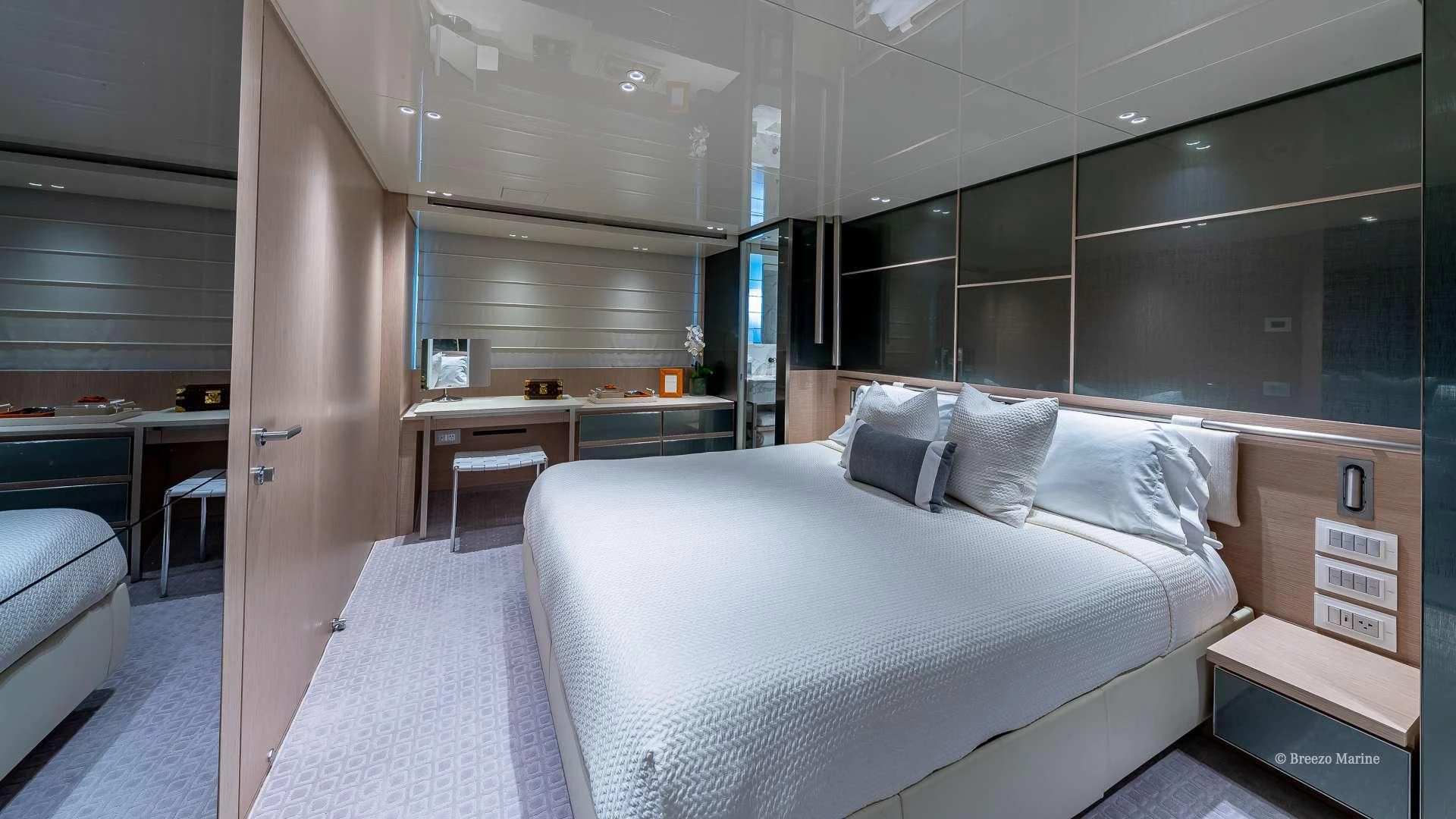 a room with a bed and desk aboard MAVE Yacht for Sale