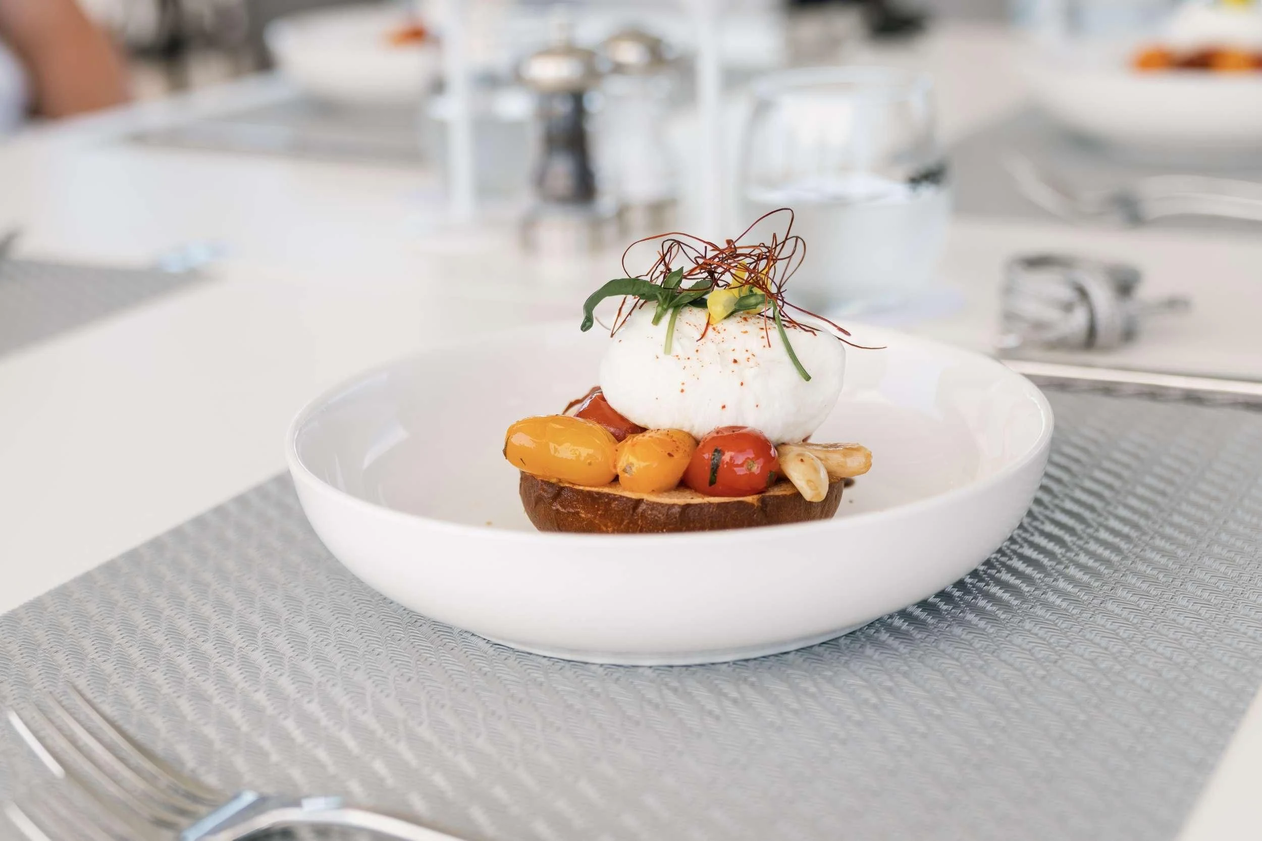 a plate of food aboard MAVE Yacht for Sale