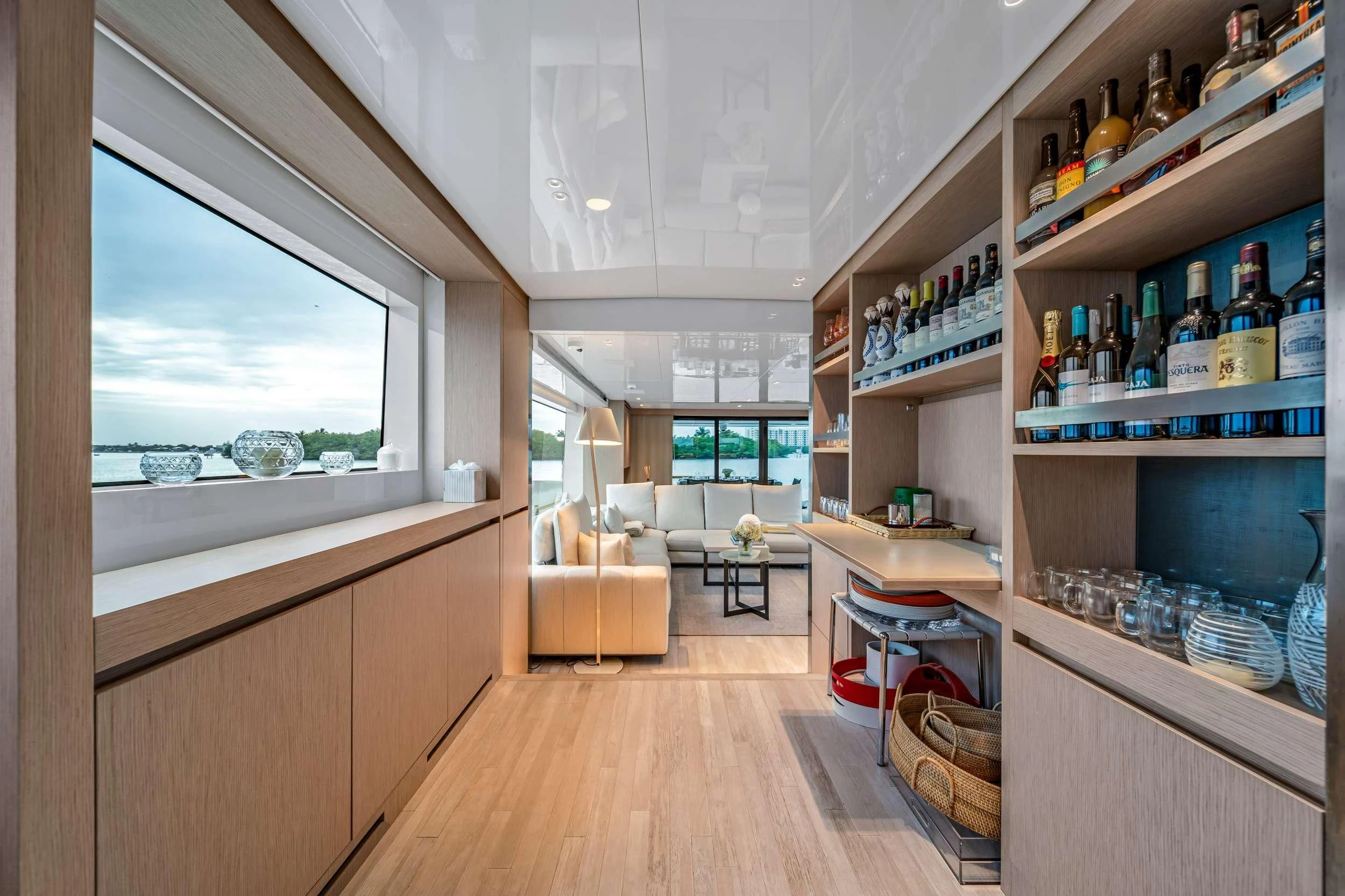 a room with shelves and bottles aboard MAVE Yacht for Sale