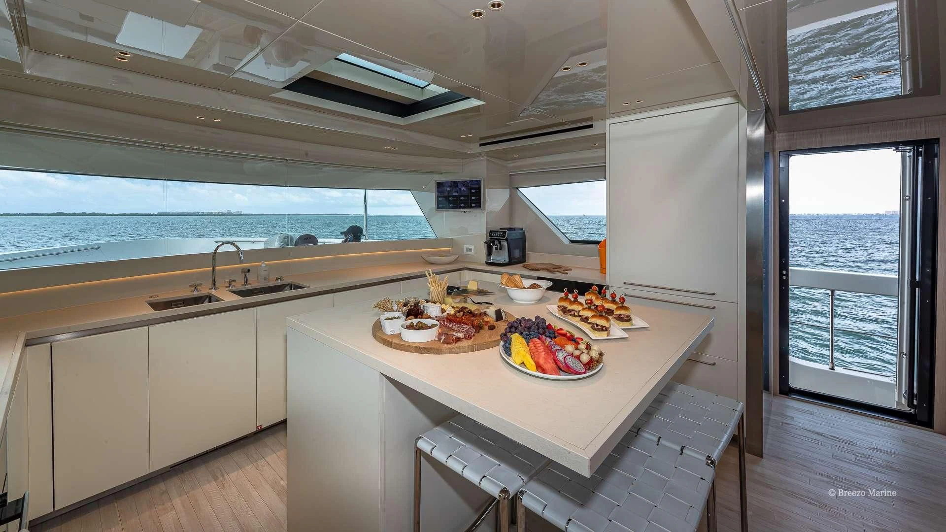 a kitchen with a large window aboard MAVE Yacht for Sale