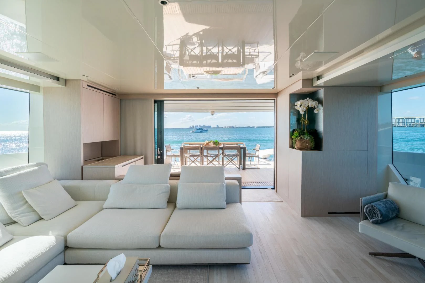 a living room with a large window aboard MAVE Yacht for Sale
