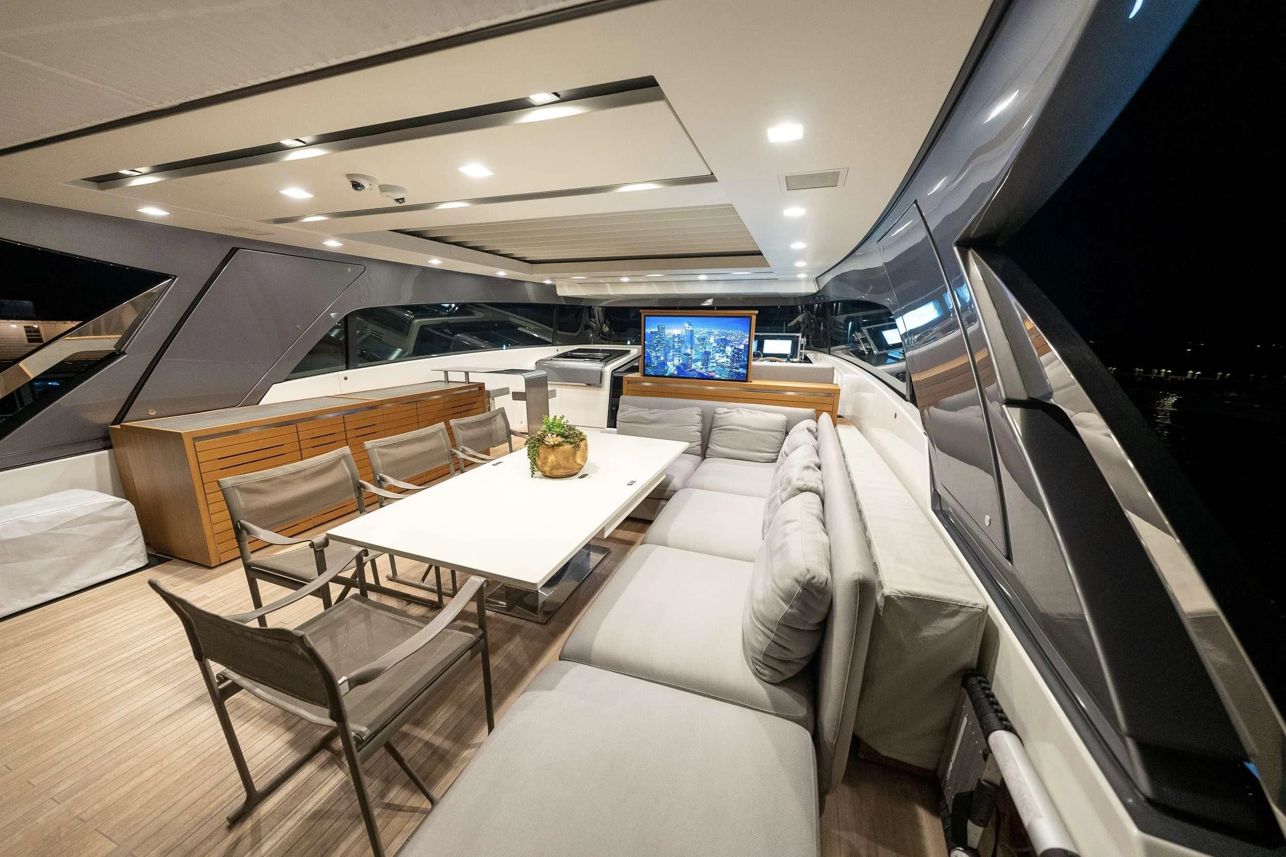 a room with a table chairs and a couch aboard MAVE Yacht for Sale