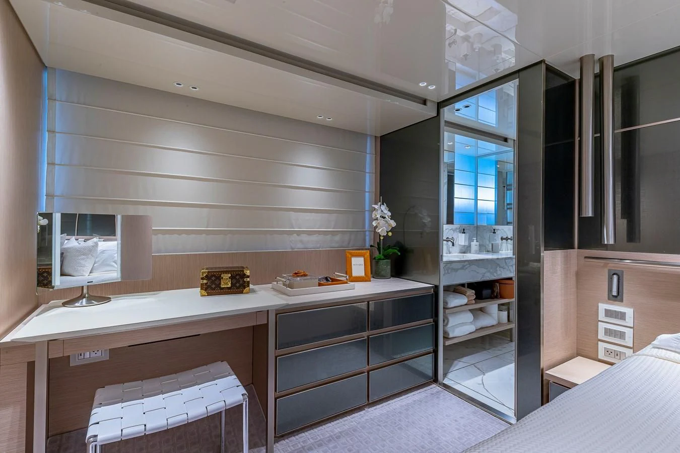 a room with a large mirror and a counter with a sink aboard MAVE Yacht for Sale