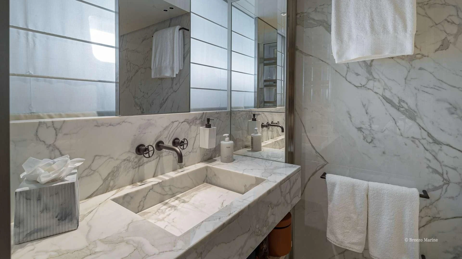 a bathroom with a large mirror aboard MAVE Yacht for Sale