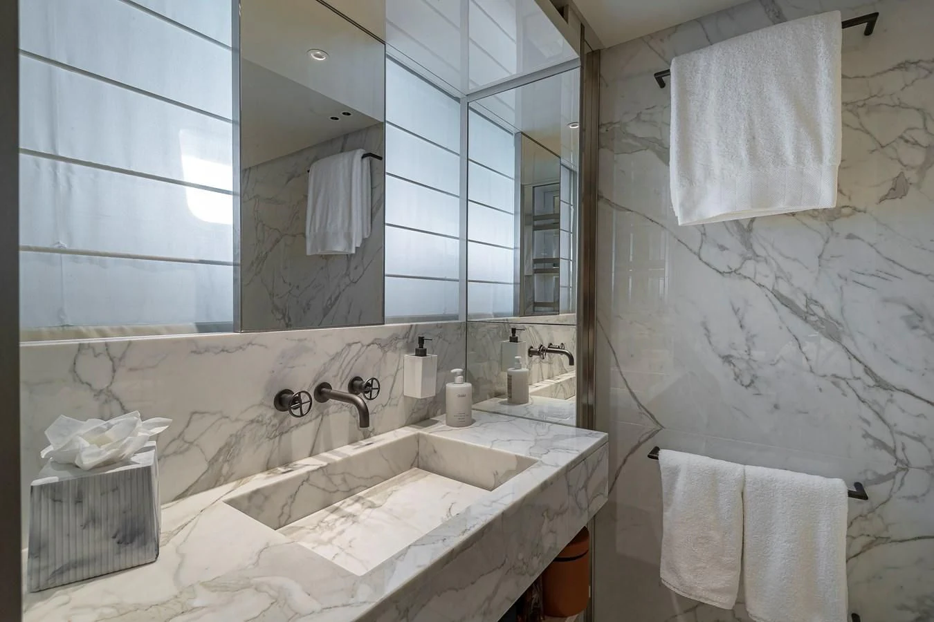 a bathroom with a large mirror aboard MAVE Yacht for Sale