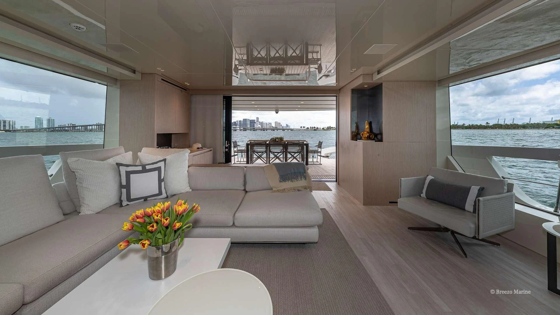 a living room with a large window aboard MAVE Yacht for Sale