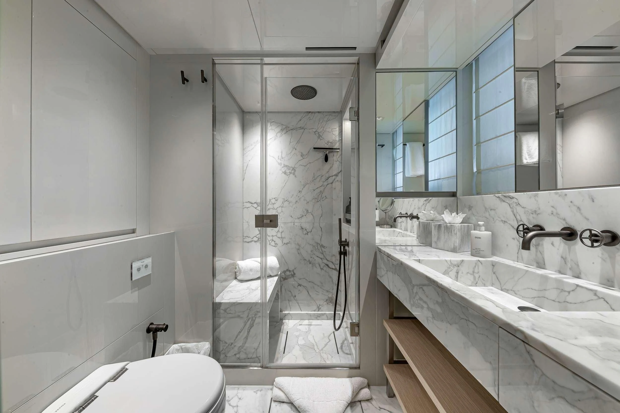 a bathroom with a glass shower aboard MAVE Yacht for Sale