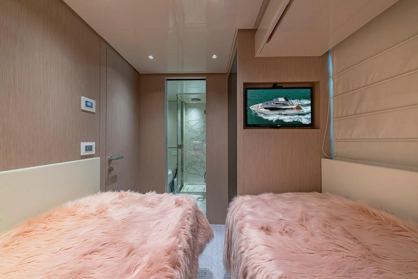 a bedroom with a bed and a television aboard MAVE Yacht for Sale
