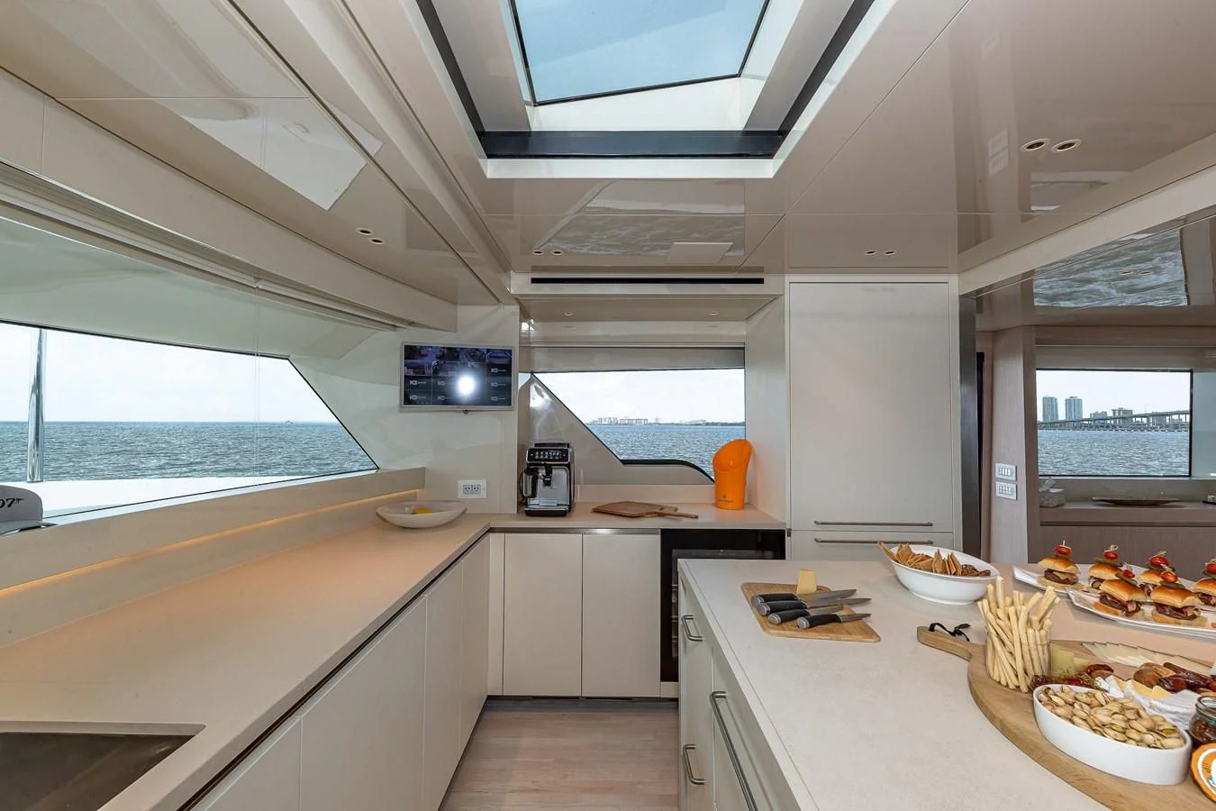 a kitchen with a large window aboard MAVE Yacht for Sale
