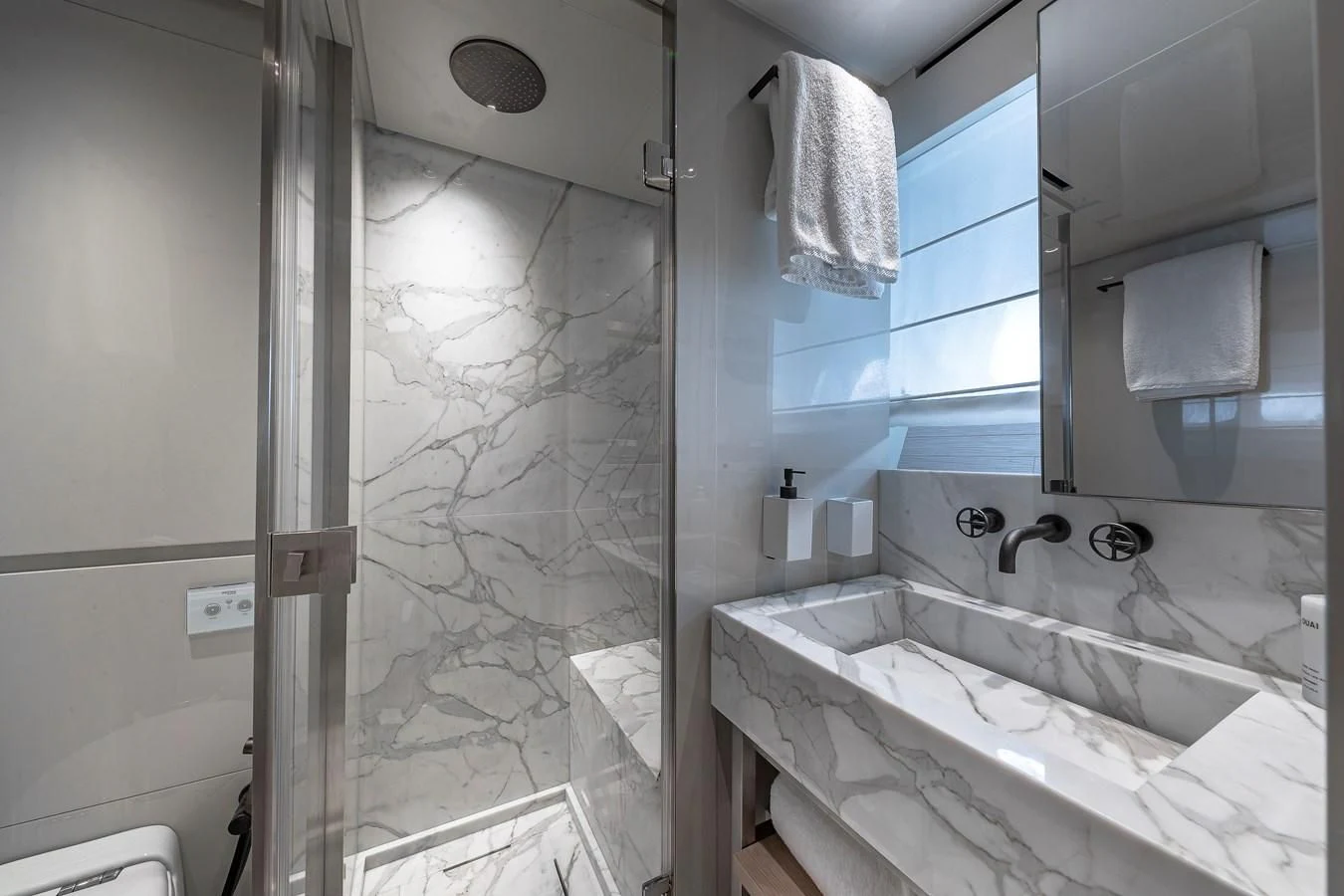 a bathroom with a glass shower aboard MAVE Yacht for Sale