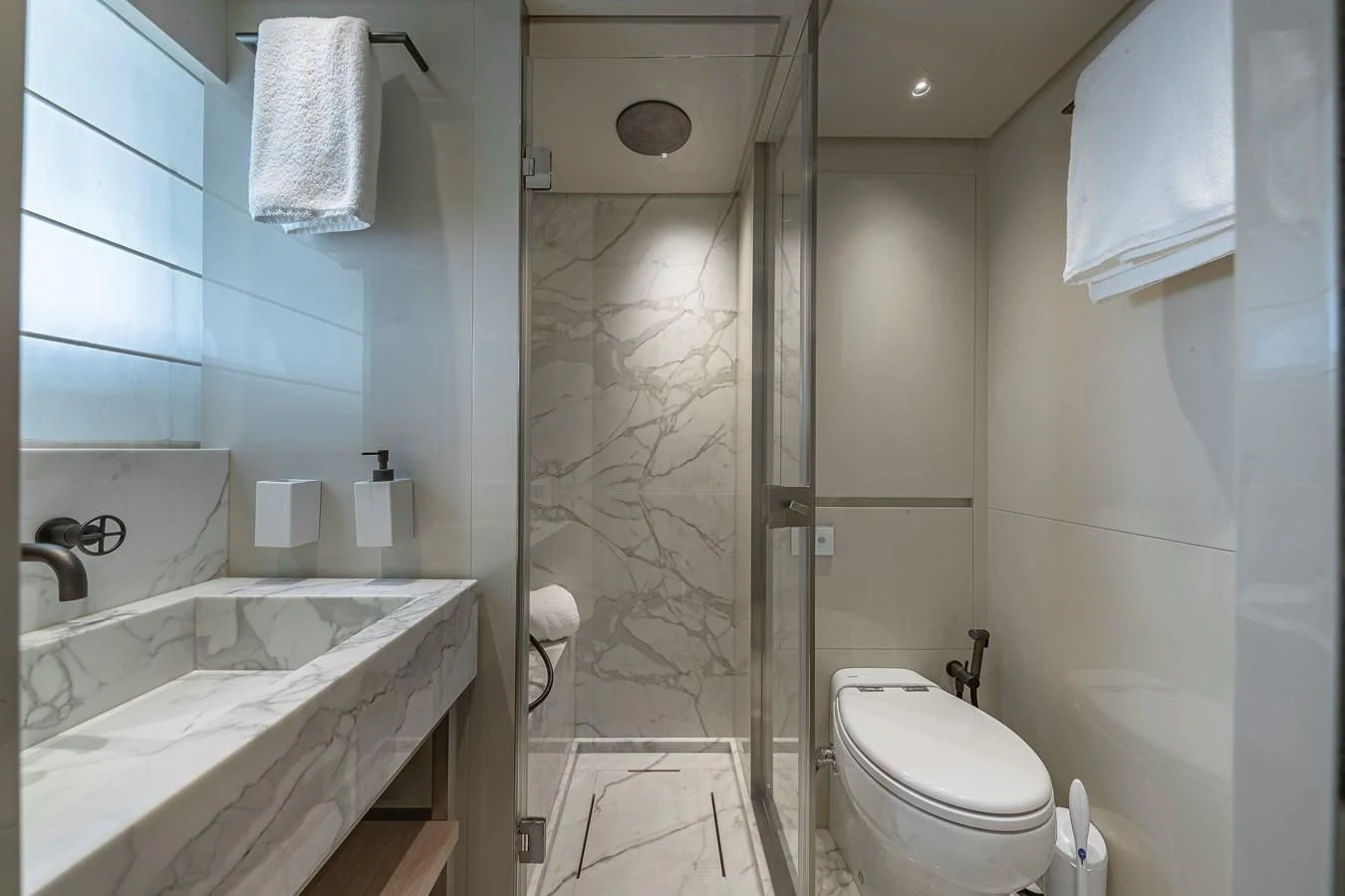 a bathroom with a shower and toilet aboard MAVE Yacht for Sale