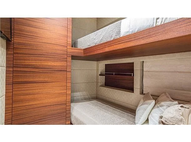 a bed with a wooden frame aboard PRIMA MEA Yacht for Sale