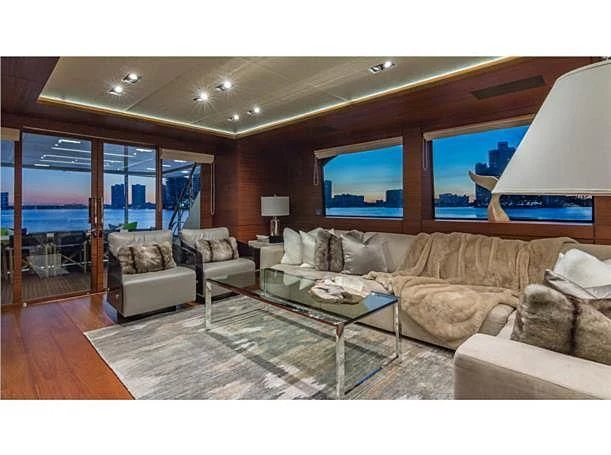 a living room with a large window aboard PRIMA MEA Yacht for Sale