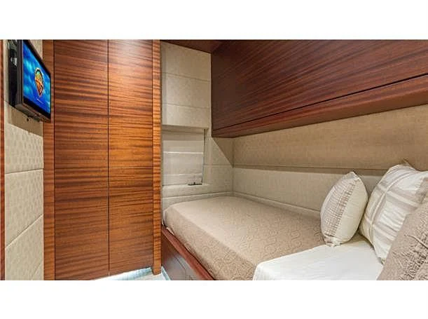 a room with a couch and tv aboard PRIMA MEA Yacht for Sale