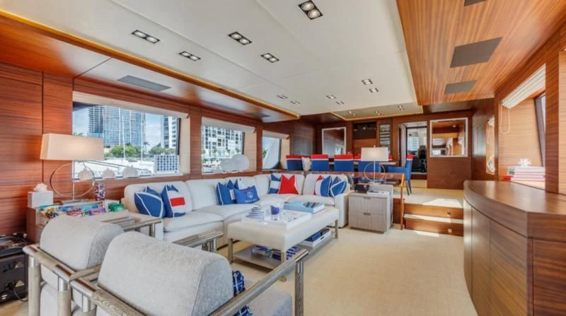 a room with a couch and a table aboard PRIMA MEA Yacht for Sale